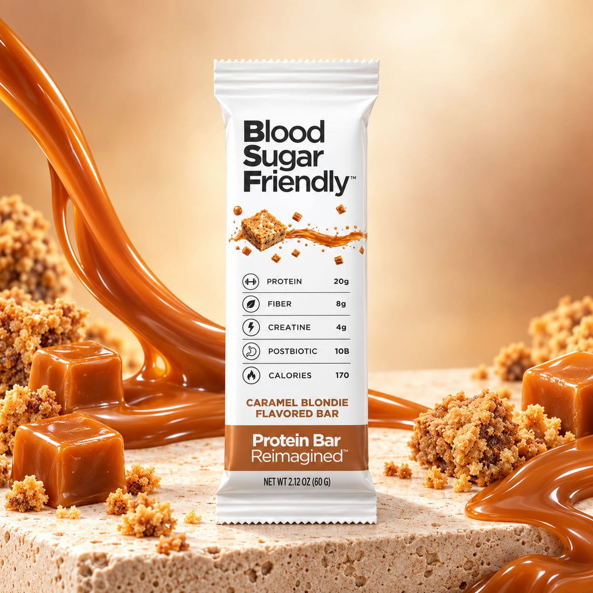 Protein Bar Reimagined™ Caramel Blondie bar on a stone slab with caramel cubes, blondie crumbs and a caramel swirl