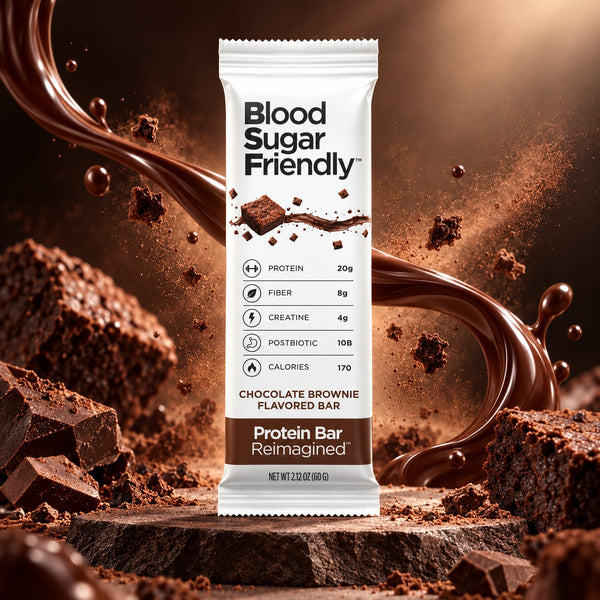 Protein Bar Reimagined™ Chocolate Brownie bar on dark stone with brownie chunks, chocolate pieces and a chocolate swirl